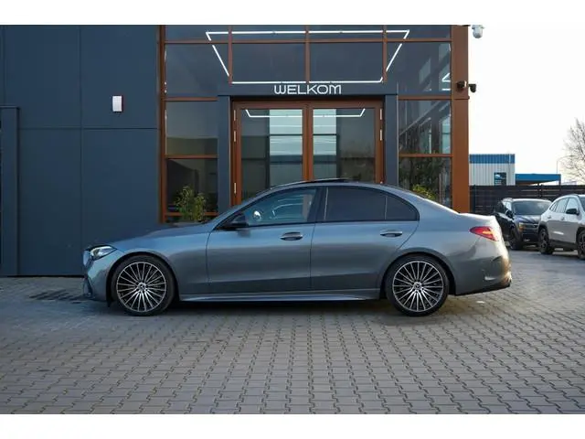 Mercedes-benz C-klasse 180 AMG Line | Pano | Sfeer | Led | Cruise | Trekhaak | Camera