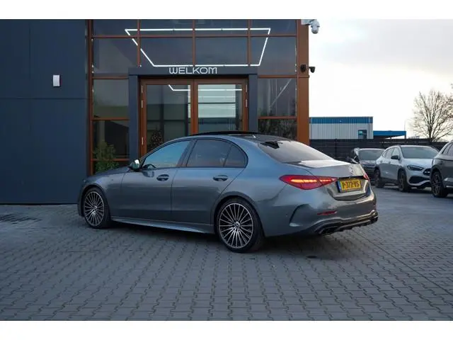 Mercedes-benz C-klasse 180 AMG Line | Pano | Sfeer | Led | Cruise | Trekhaak | Camera