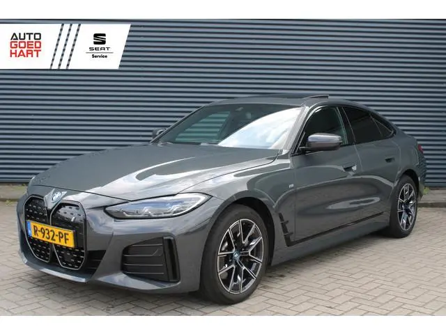 BMW i4 eDrive40 84 kWh M-Sport SOH-100% Dravitgrau Schuif-/kanteldak Leer Harman-Kardon Camera