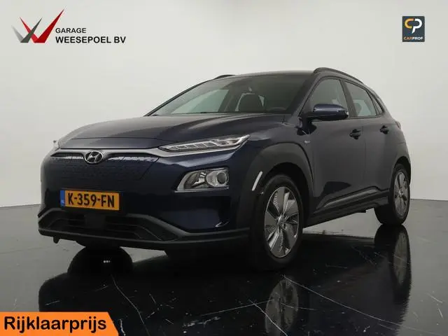 Hyundai Kona EV 64kWh Comfort (SOH 99,1%) - Navigatie - Camera - Climate control - Cruise control -...