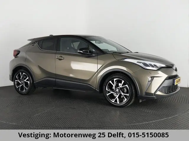 Toyota C-HR 1.8 HYBRID BI-TONE LUXERY LINE GARANTIE 5-2032 TREKHAAK. 4 SEIZOENEN BANDEN.NAVIGATIE. S...